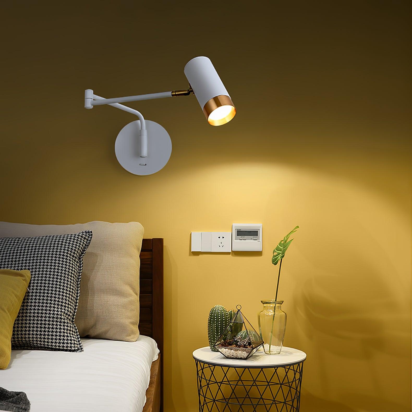 White and gold swing arm wall lamp with arm folded in