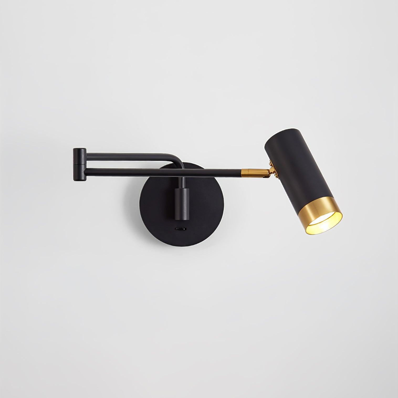 Swing arm wall lamp in white and gold beside a bed