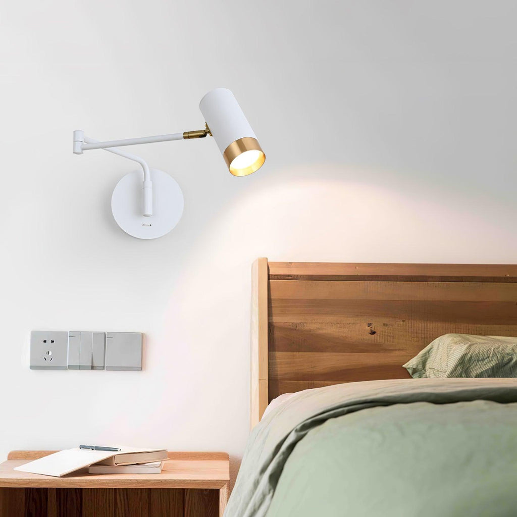 Swing arm wall lamp mounted along a hallway wall