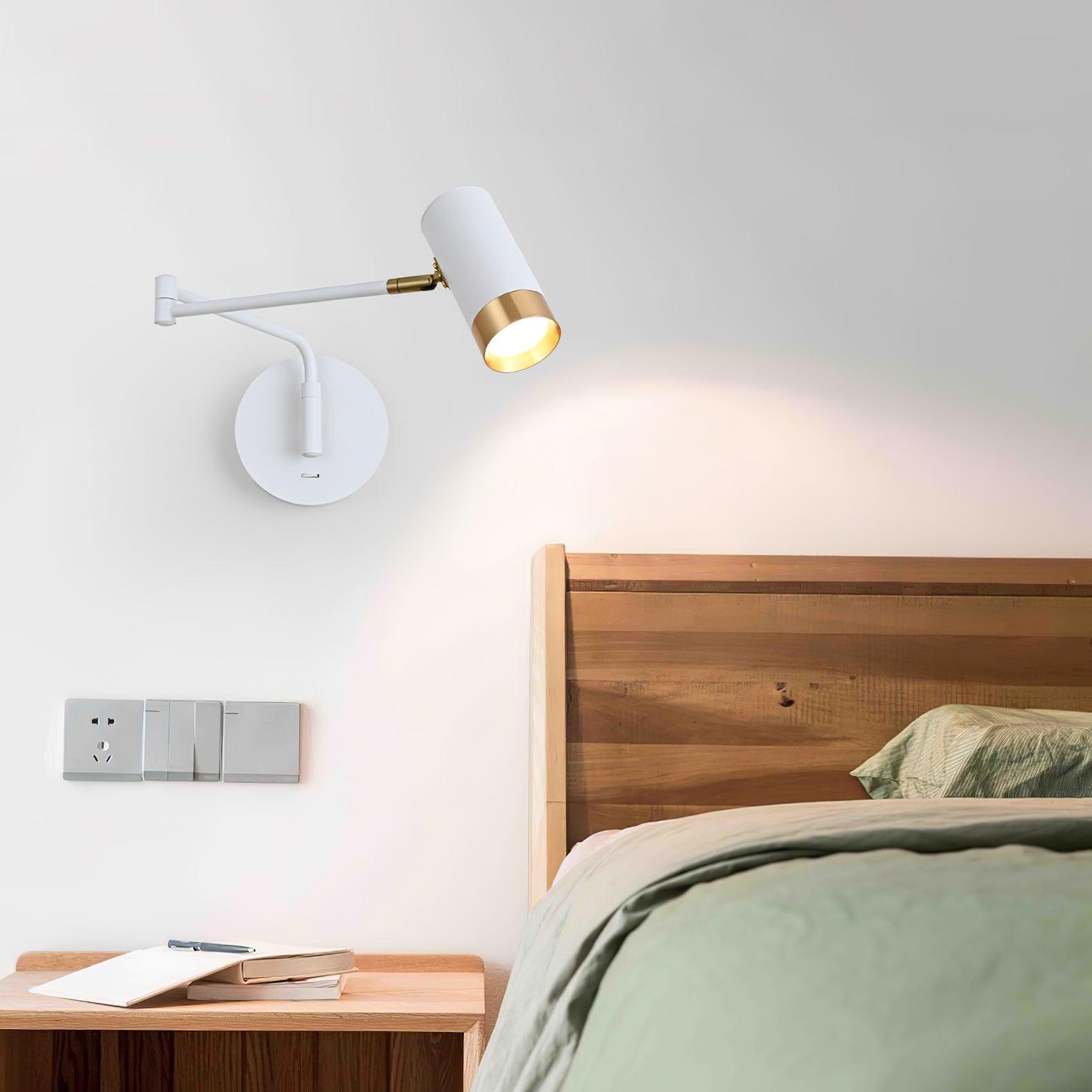 Swing arm wall lamp mounted along a hallway wall