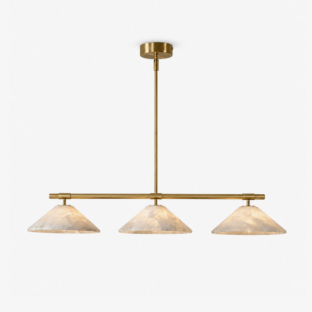 On a plain backdrop, this Clérachic chandelier shows its three alabaster cone shades on a brass bar.