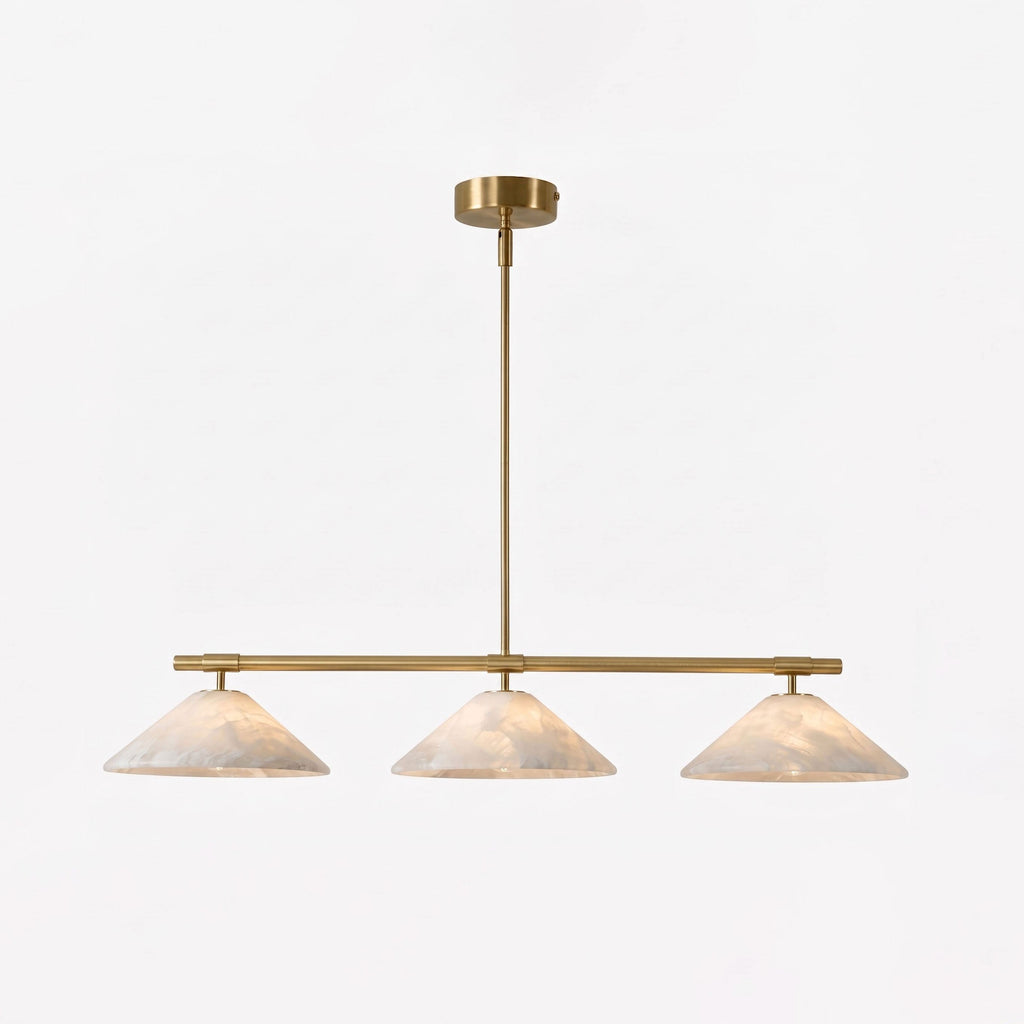 This lit Clérachic chandelier shows its brass stem and alabaster cone shades against a plain white backdrop.