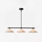 This matte black Clérachic chandelier hangs lit against a plain white studio background.