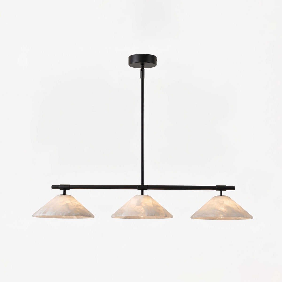 This matte black Clérachic chandelier hangs lit against a plain white studio background.