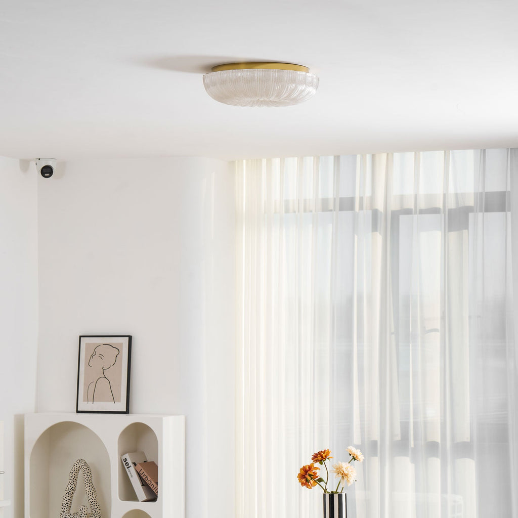 Frosted glass ceiling light glowing above a hallway