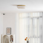 Frosted glass ceiling light glowing above a hallway