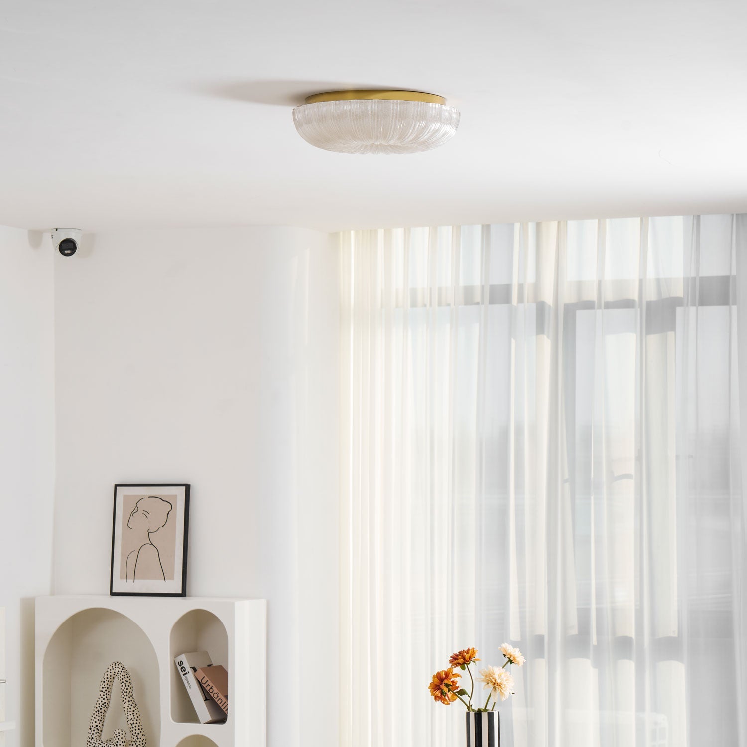 Frosted glass ceiling light glowing above a hallway