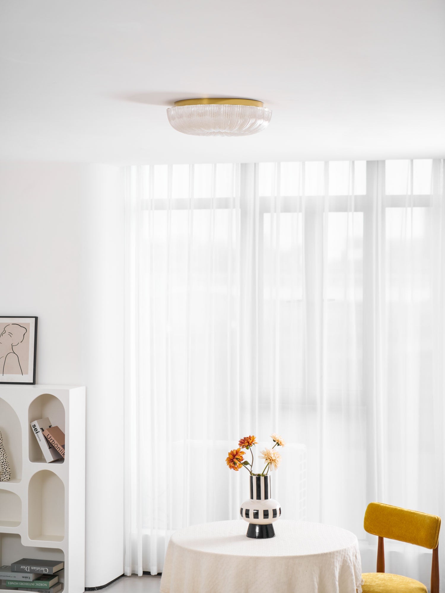 Round frosted glass ceiling light viewed at an angle