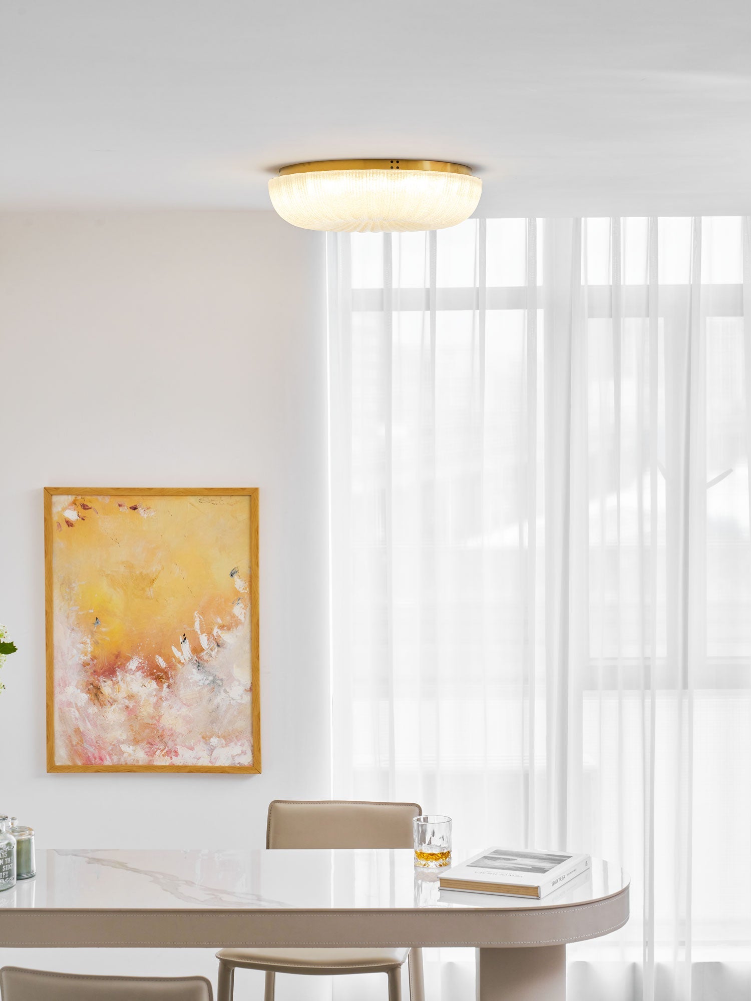 Frosted glass ceiling light glowing softly in a living room