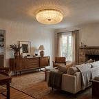 Frosted glass ceiling light glowing warm white in a hallway