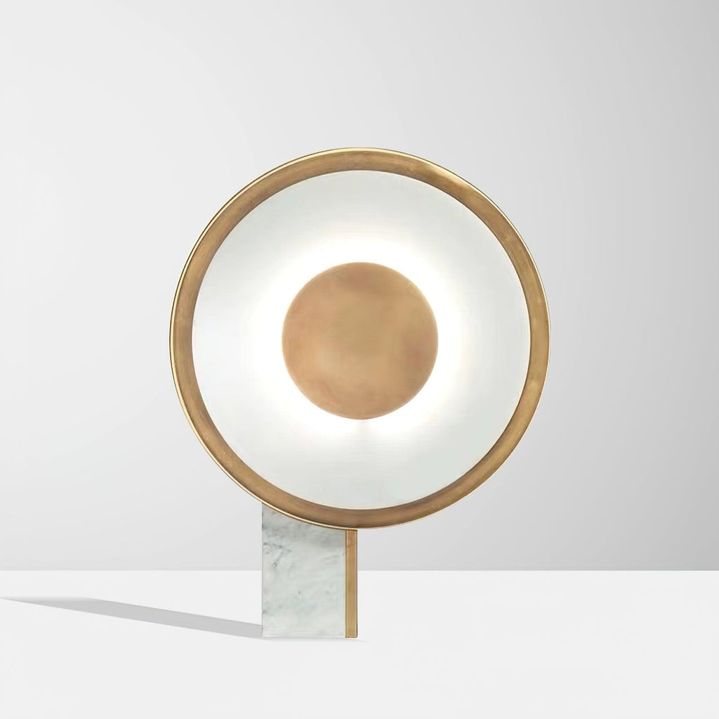 Straight-on close crop of the Clérachic disc lamp's lit ring and centre disc against a plain grey-white background.
