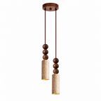 Two Clérachic pendants of different lengths hang from a round wood canopy, their travertine cylinders shown unlit on white.