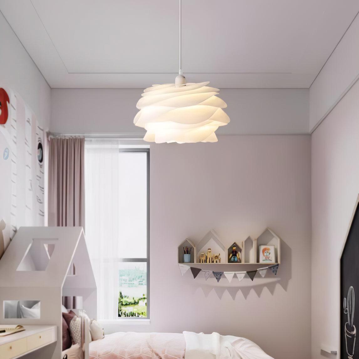 White PVC floral pendant light above a dining setting