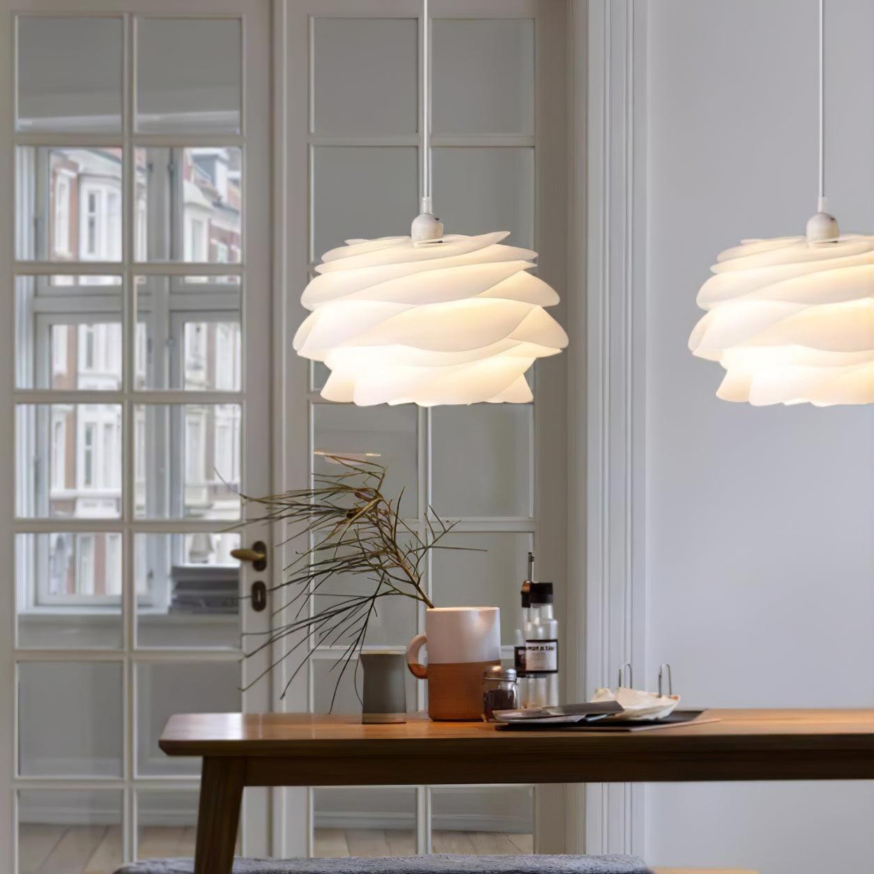 Floral pendant light with white rose petals lit warmly