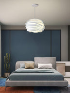 Floral rose pendant light shown from below, petals lit