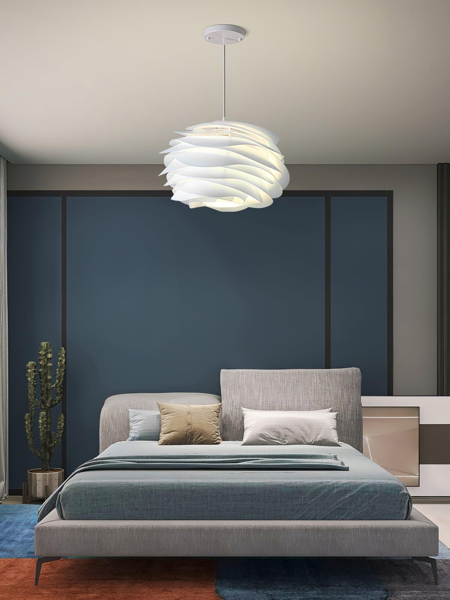 Floral rose pendant light shown from below, petals lit