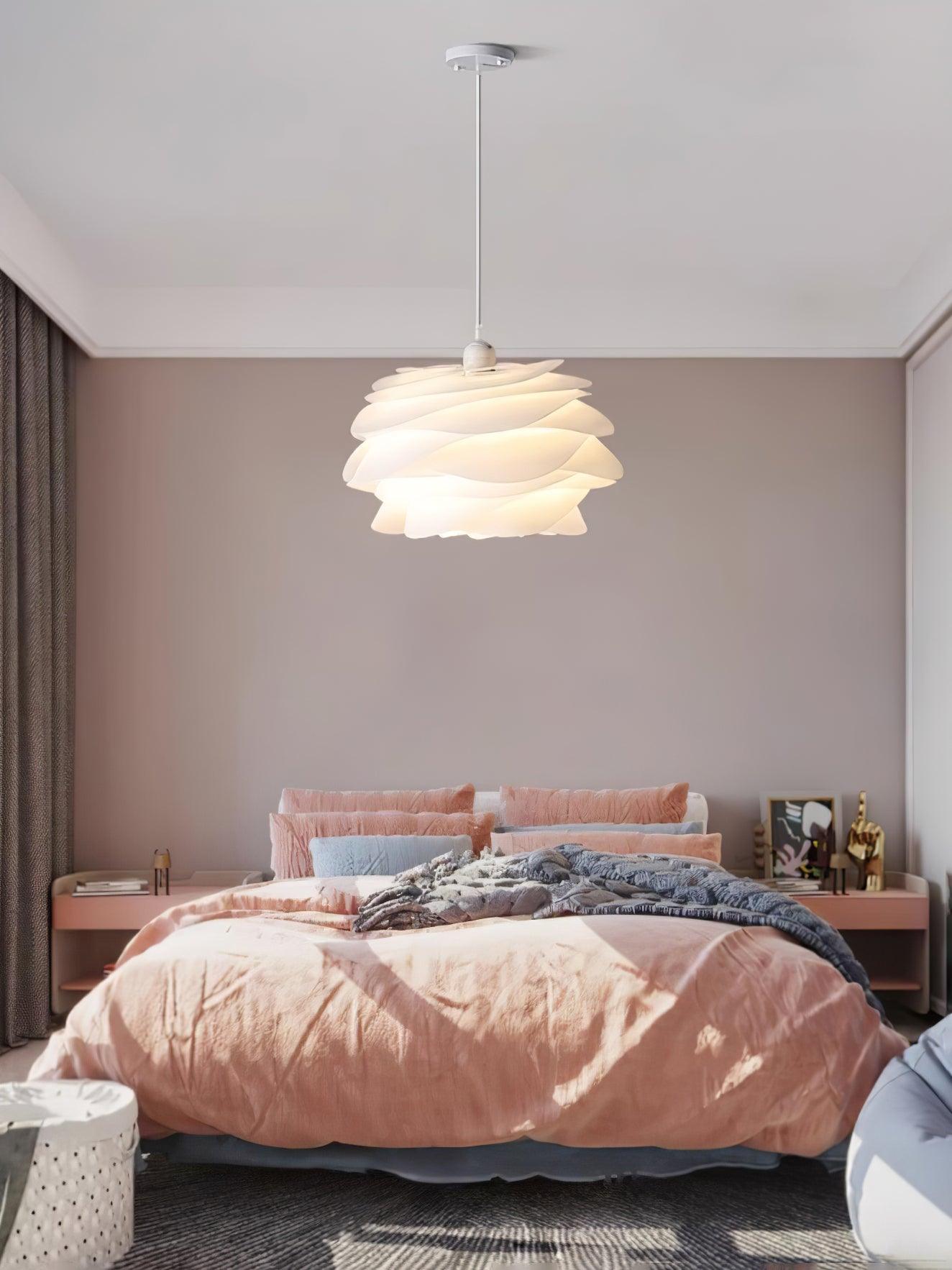 White rose pendant light suspended in an entryway