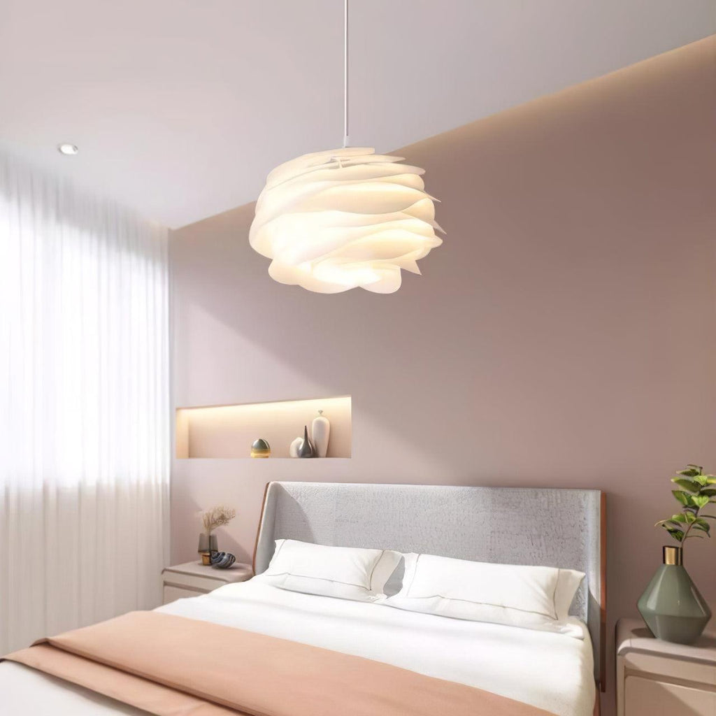 Floral rose pendant light casting a diffused white glow