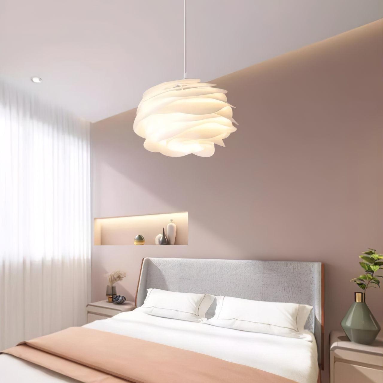 Floral rose pendant light casting a diffused white glow