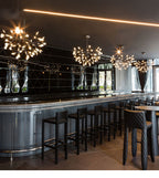 Branching rose gold firefly chandelier in a living room