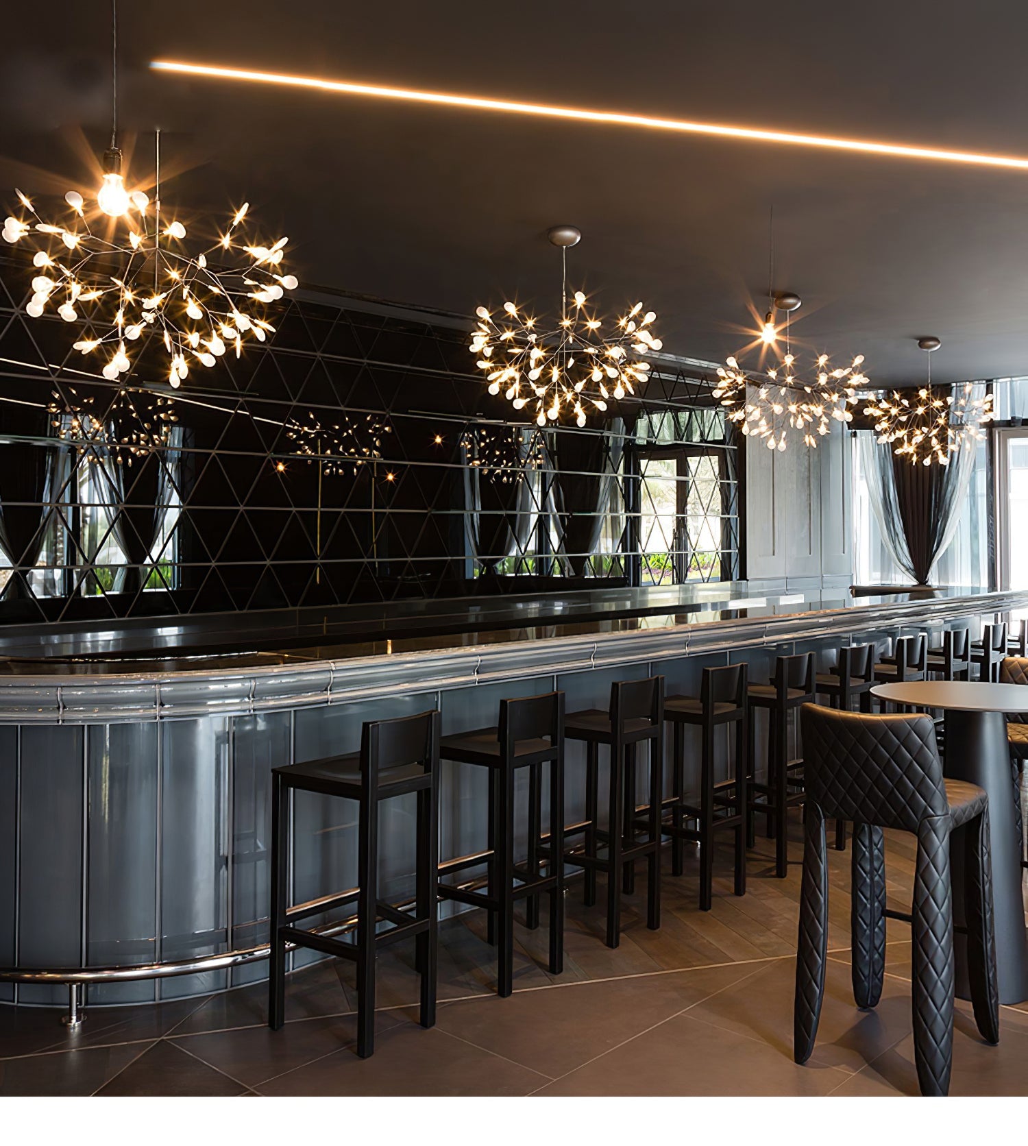 Branching rose gold firefly chandelier in a living room