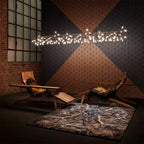 Rose gold LED chandelier with leaves fanned outward
