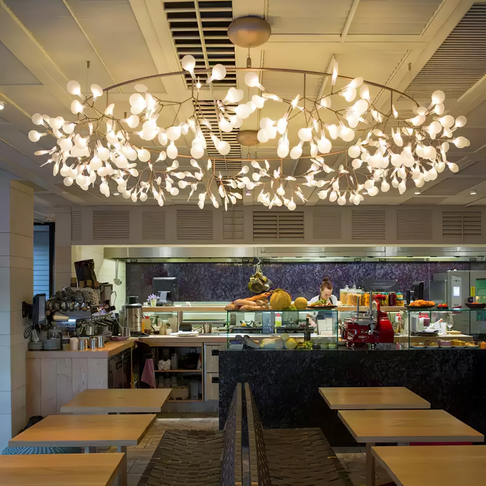 Firefly chandelier glowing softly above a dining space
