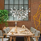 Rose gold branch chandelier with delicate lit leaves