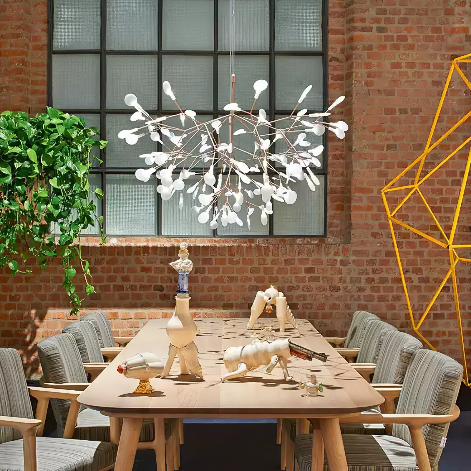 Rose gold branch chandelier with delicate lit leaves