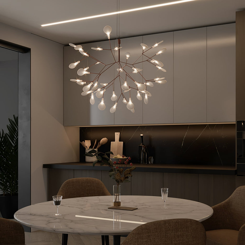 Rose gold branch chandelier with warm glowing leaves
