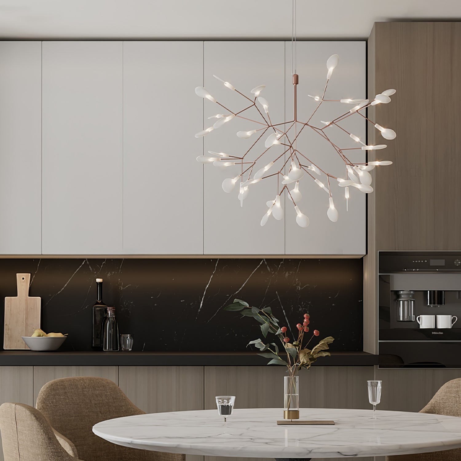 Firefly LED chandelier shown suspended over a table