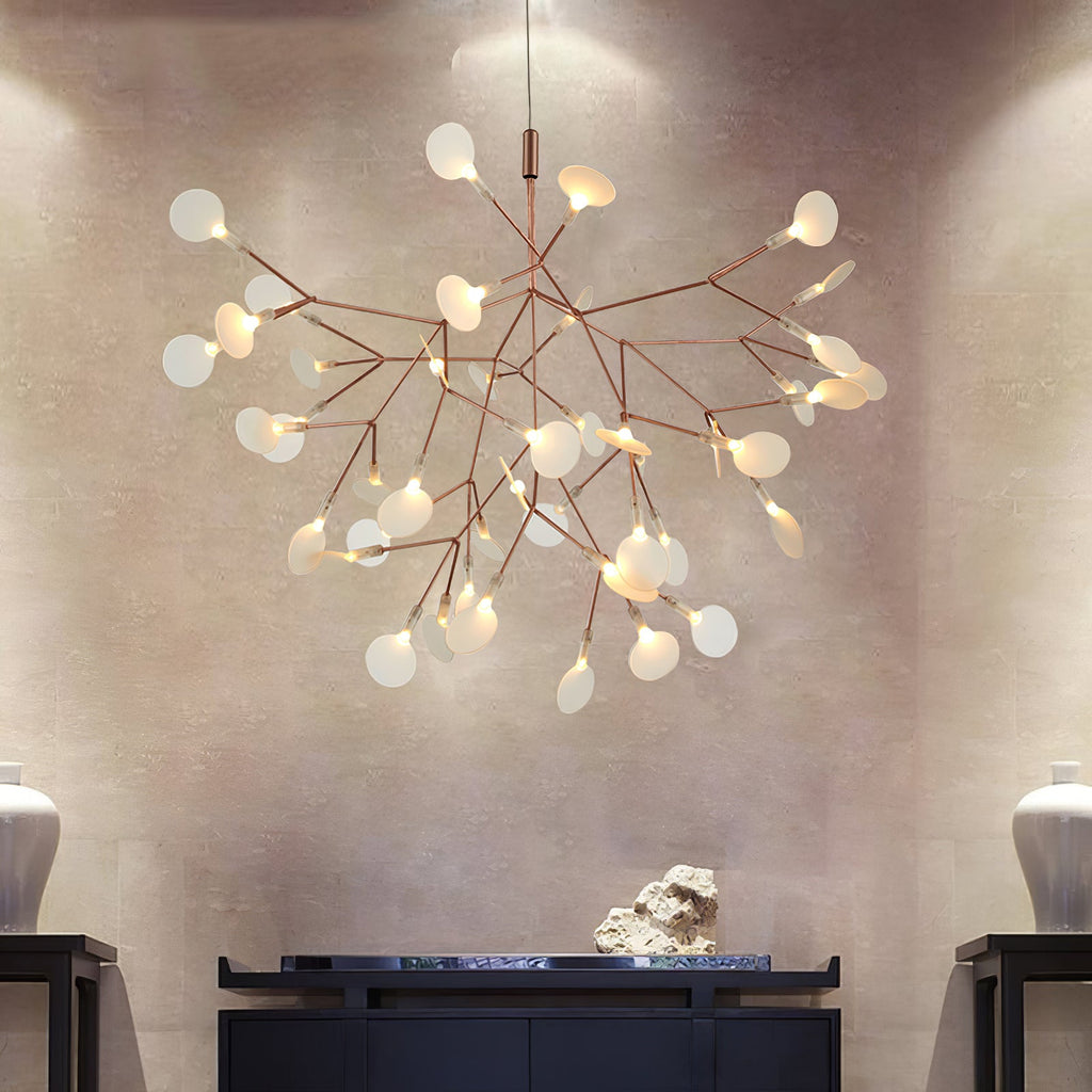 Rose gold chandelier with conductive leaf lights glowing