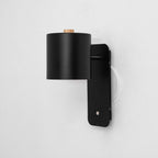Cylinder wall lamp close-up showing brushed metal body