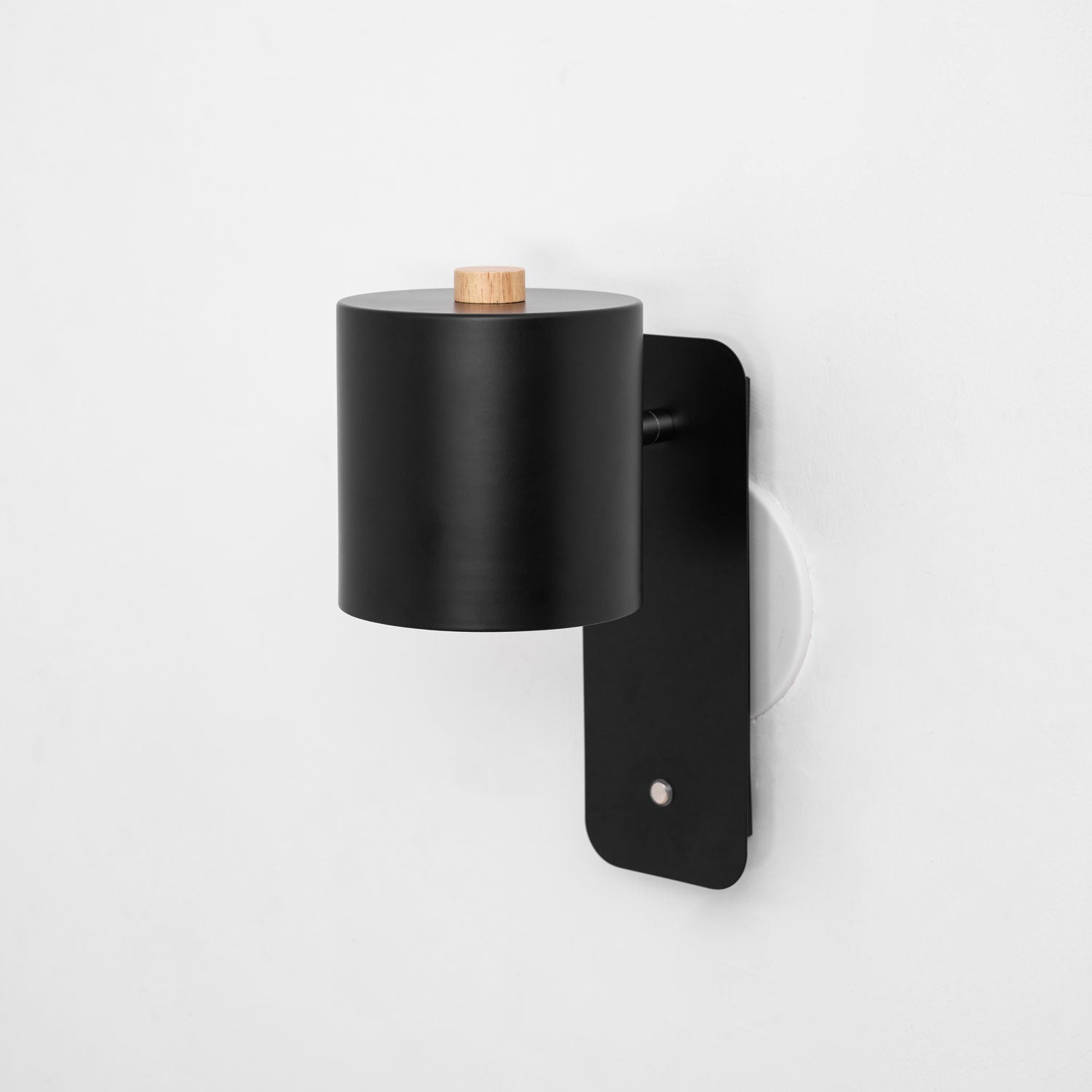 Rechargeable cylinder wall lamp styled in a cosy room
