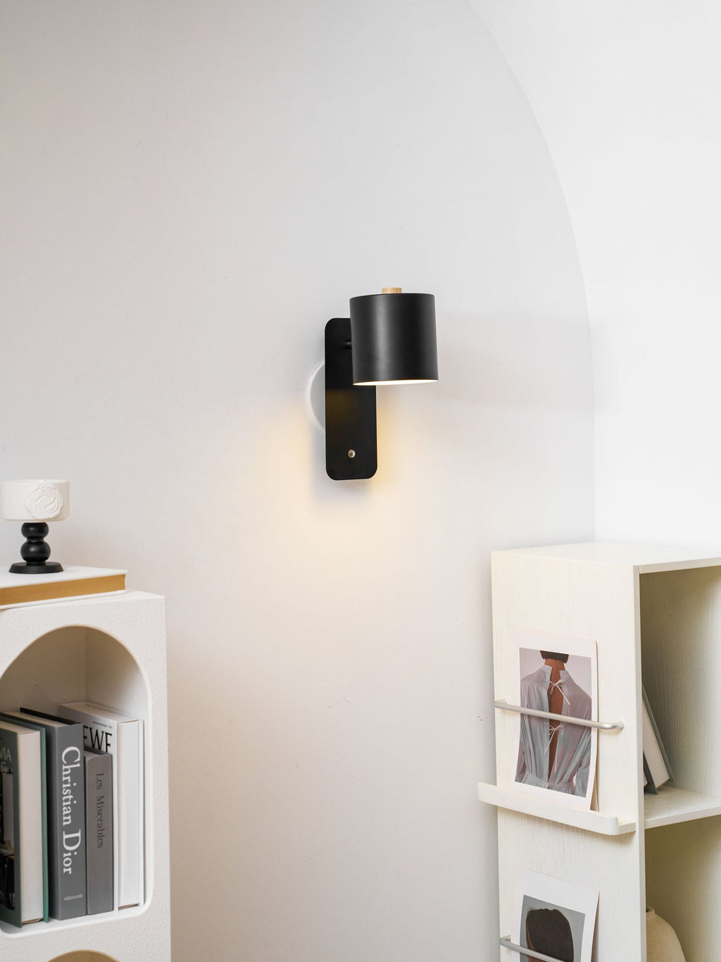 Cordless cylinder wall lamp mounted with adhesive strip