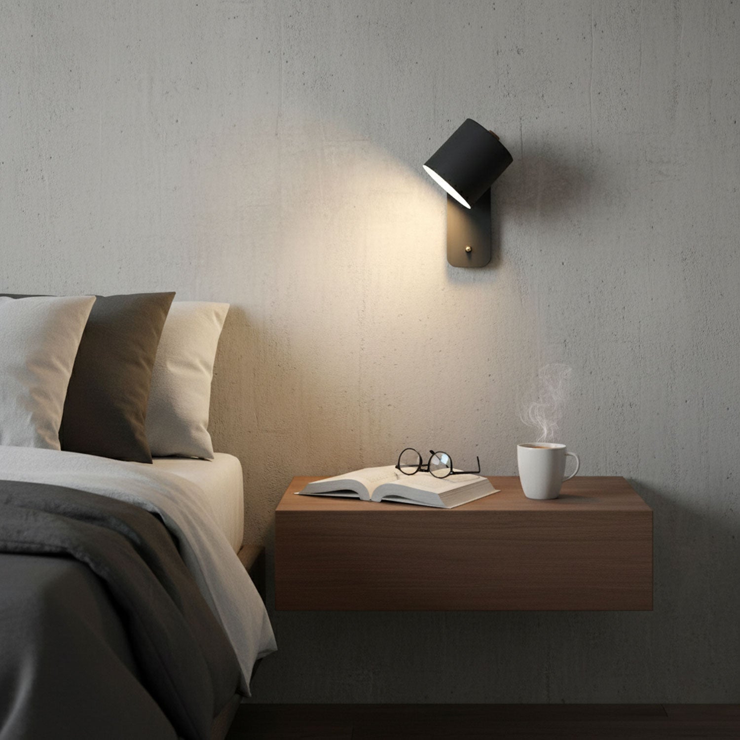 Matte cylinder wall lamp angled over a bedside table