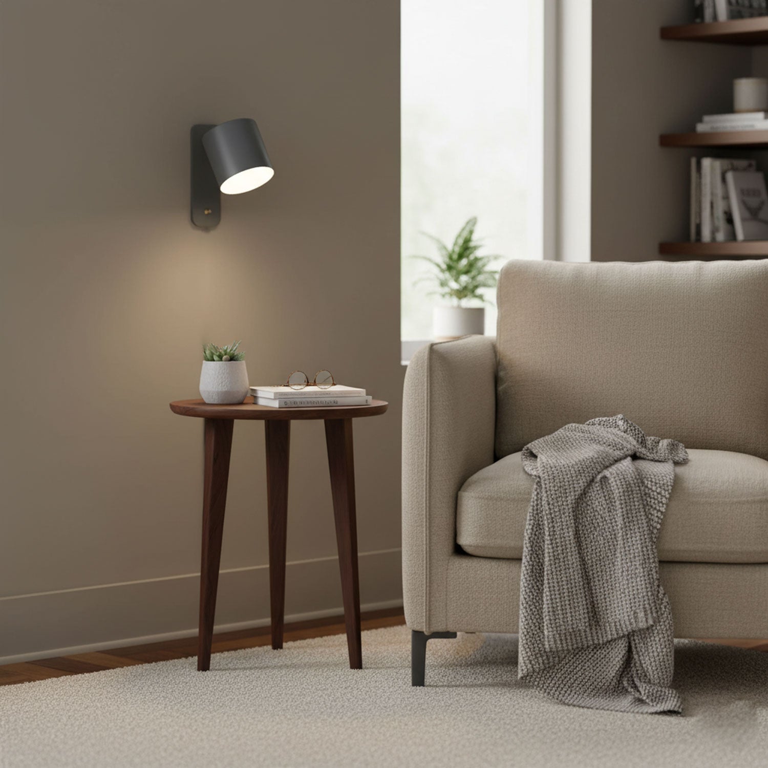 Rotating cylinder wall lamp beside a styled shelf