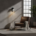 Cylinder wall lamp mounted in a modern interior setting