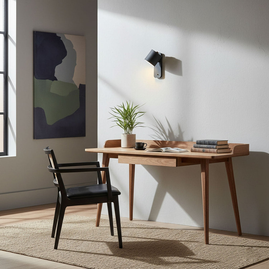Rotating cylinder wall lamp with focused downward glow