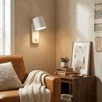 Green matte cylinder wall lamp against a neutral backdrop