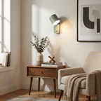 Black cylinder wall lamp shown from a side angle