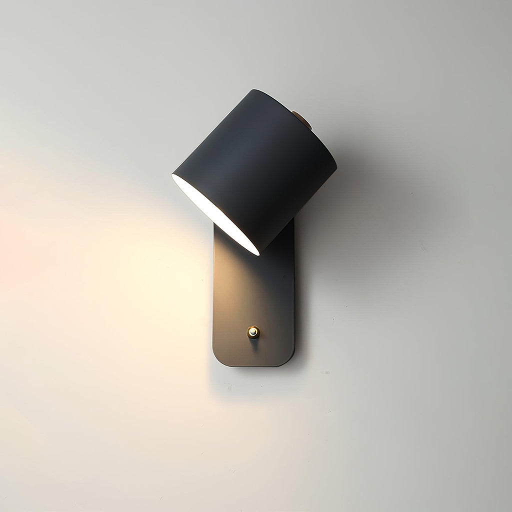 Slim metal wall lamp with adjustable cylinder shade indoors