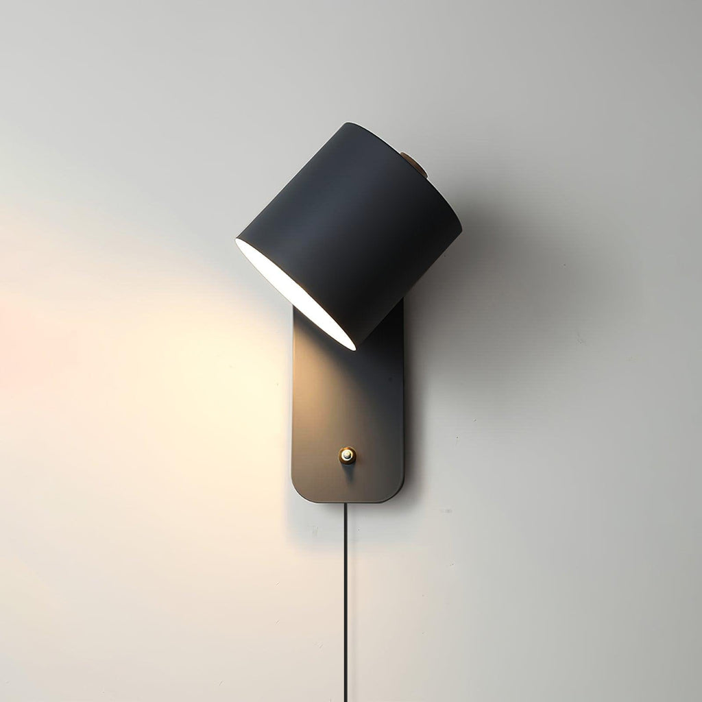 Cylinder wall lamp tilted downward for focused reading light