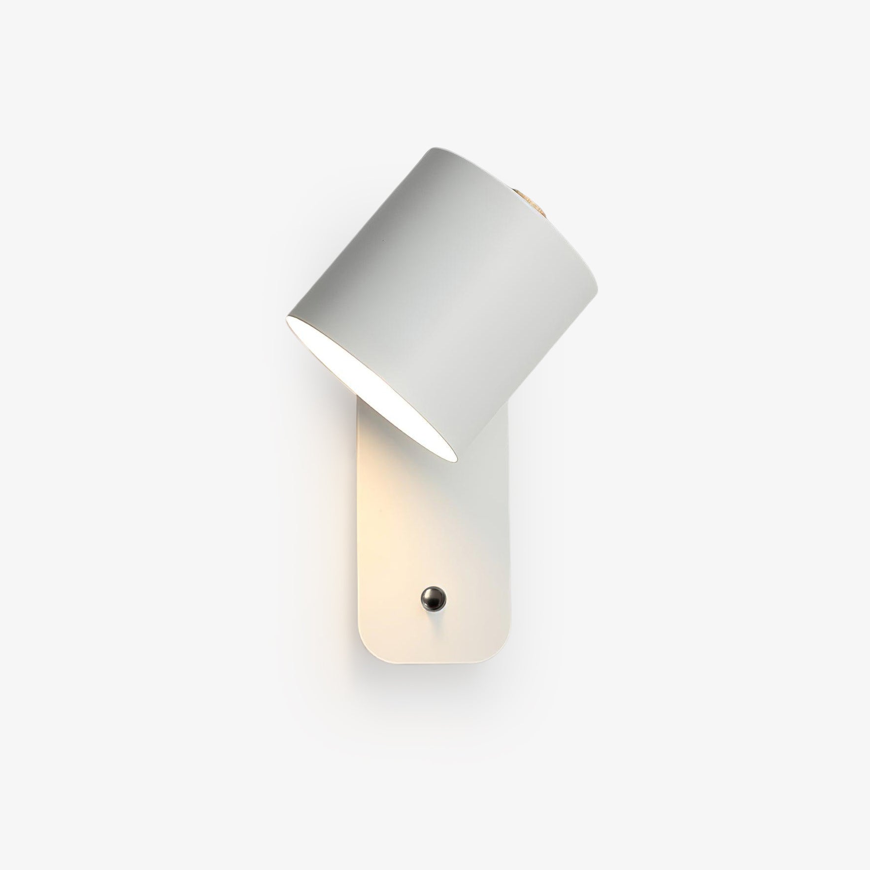 Cylinder wall lamp angled to cast directional reading light