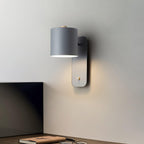 Rotating wall lamp lighting a cozy reading corner