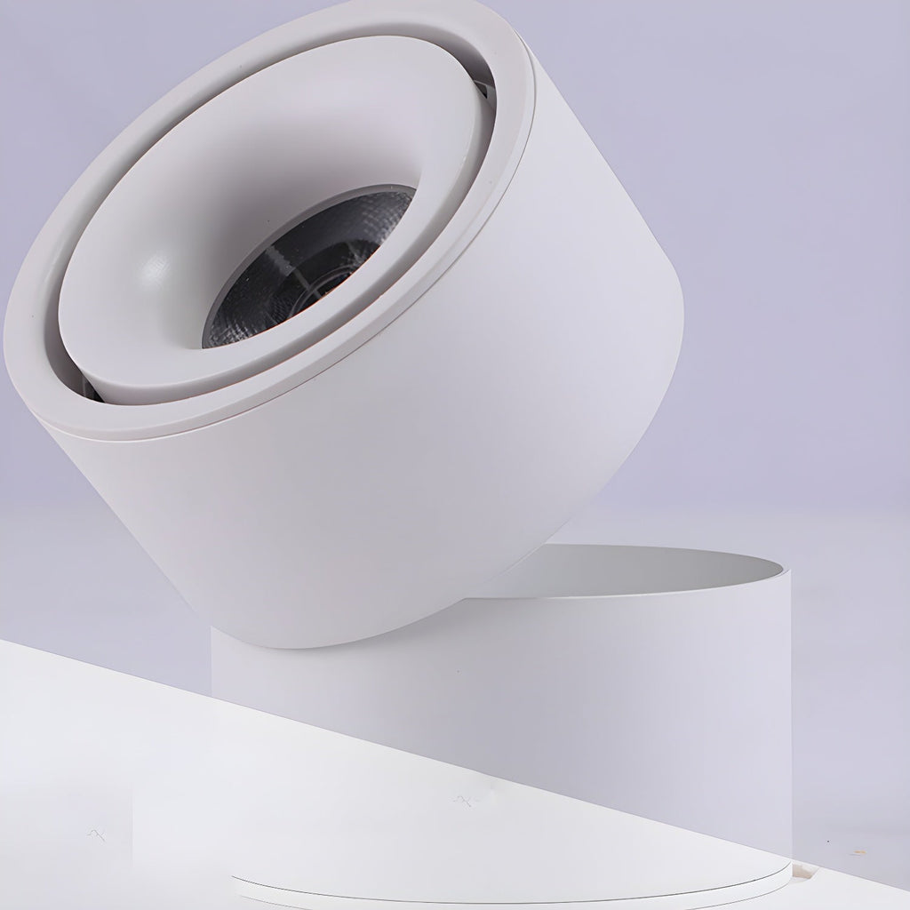 This white Clérachic spotlight is shown from another angle, its head tilted against a lavender backdrop.