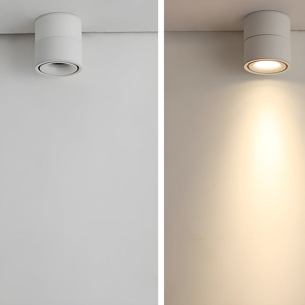 Two views of this white Clérachic spotlight: mounted plain on a wall, then lit with its beam angled down.