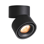 Lit and isolated on white, this Clérachic spotlight casts a warm beam from its black housing.