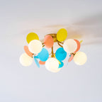 Macaron ceiling lamp with pastel discs styled in a room