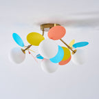 Macaron ceiling lamp glowing warm above a child's room